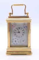 A multi-dial miniature carriage clock. 10 cm high.