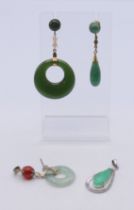 Four various jade earrings. The largest 5.5 cm high.
