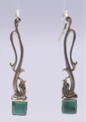 A pair of silver and turquoise earrings. 7 cm high.