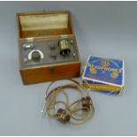 A British Thomas Houston Crystal Wireless radio receiver and boxed headphones. The former 28.