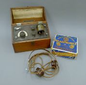 A British Thomas Houston Crystal Wireless radio receiver and boxed headphones. The former 28.