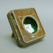 A silver and tortoiseshell travelling watch case. 10 cm wide.