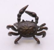 A small bronze crab. 6 cm wide.