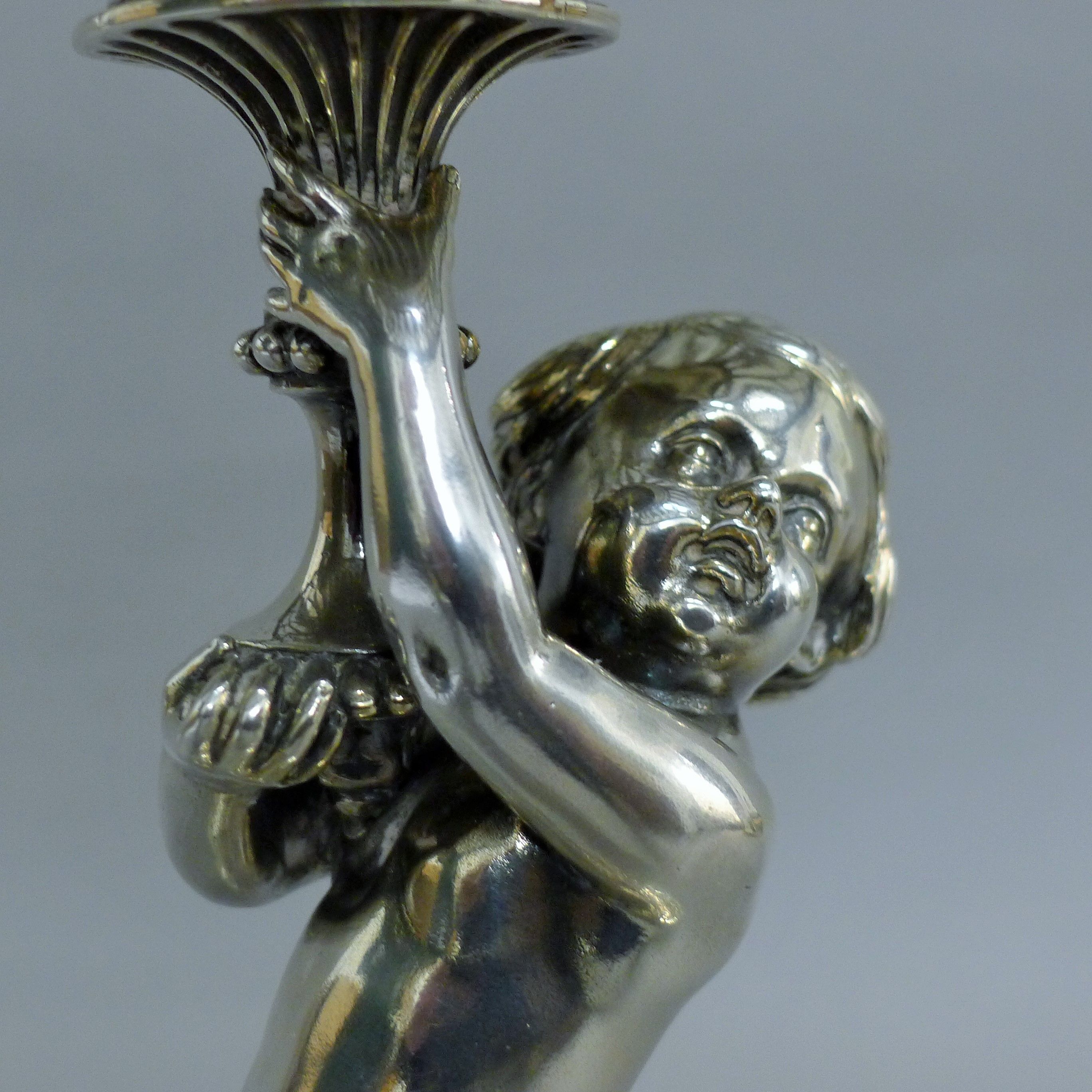 A Victorian silver centrepiece, the stem formed as a putto holding a pierced basket, - Image 7 of 10