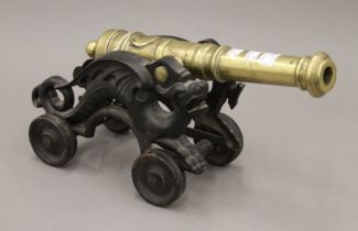 A brass and iron cannon. 45 cm long.