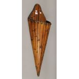 A 19th century Chinese cane and bamboo wall pocket in conical form. 85 cm high.