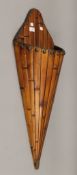 A 19th century Chinese cane and bamboo wall pocket in conical form. 85 cm high.