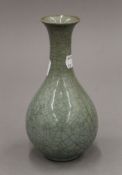 A Chinese porcelain celadon vase. 18 cm high.