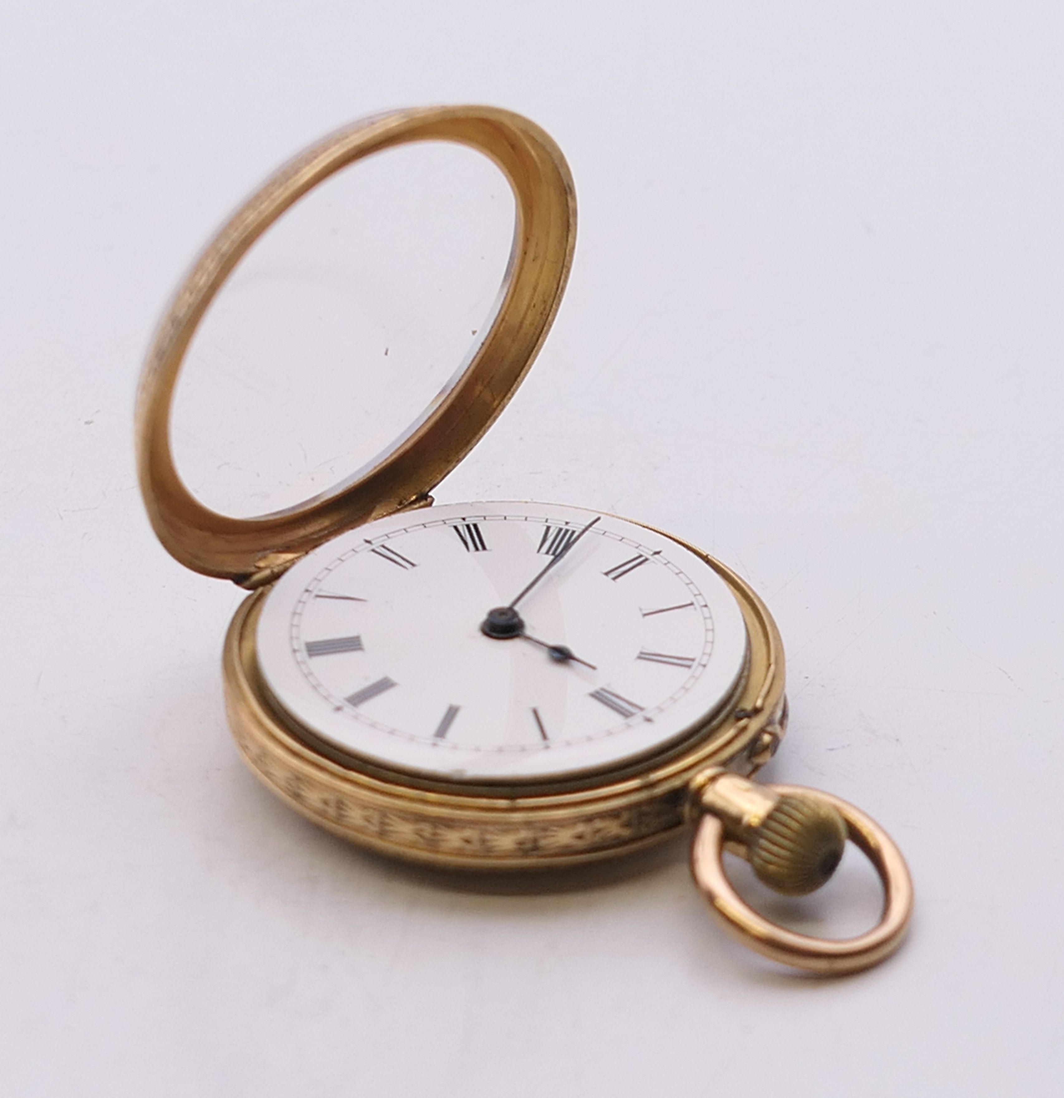 An 18 ct gold cased fob watch. 3.25 cm diameter. 31.7 grammes total weight. - Image 4 of 10