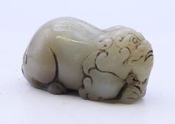 A small jade dog of fo. 4.5 cm long.
