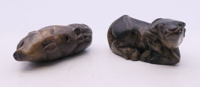 A Chinese carved model of a bull and a pig. The latter 7 cm long.