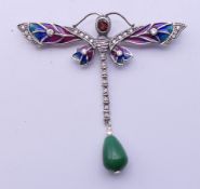A silver dragonfly brooch. 6.5 cm wide.