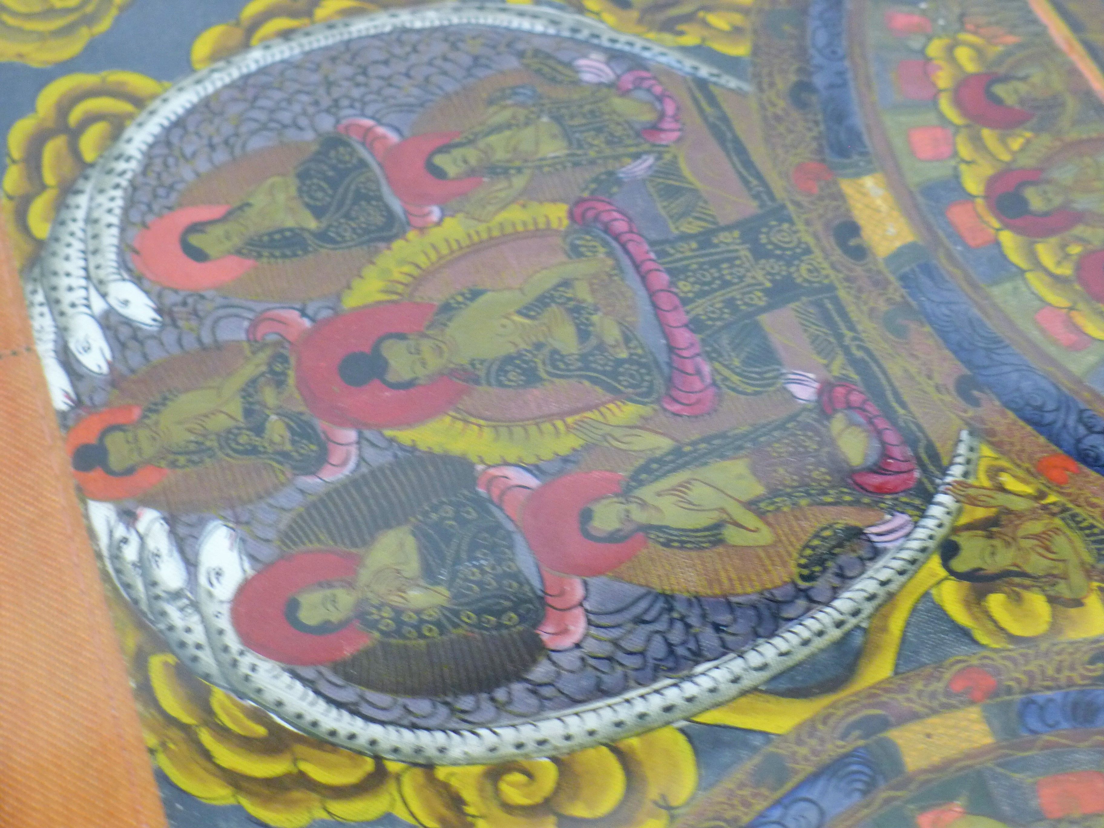 A painted antique Tibetan Buddhist painting (thanka) of deities, animals, reptiles etc. - Image 6 of 7