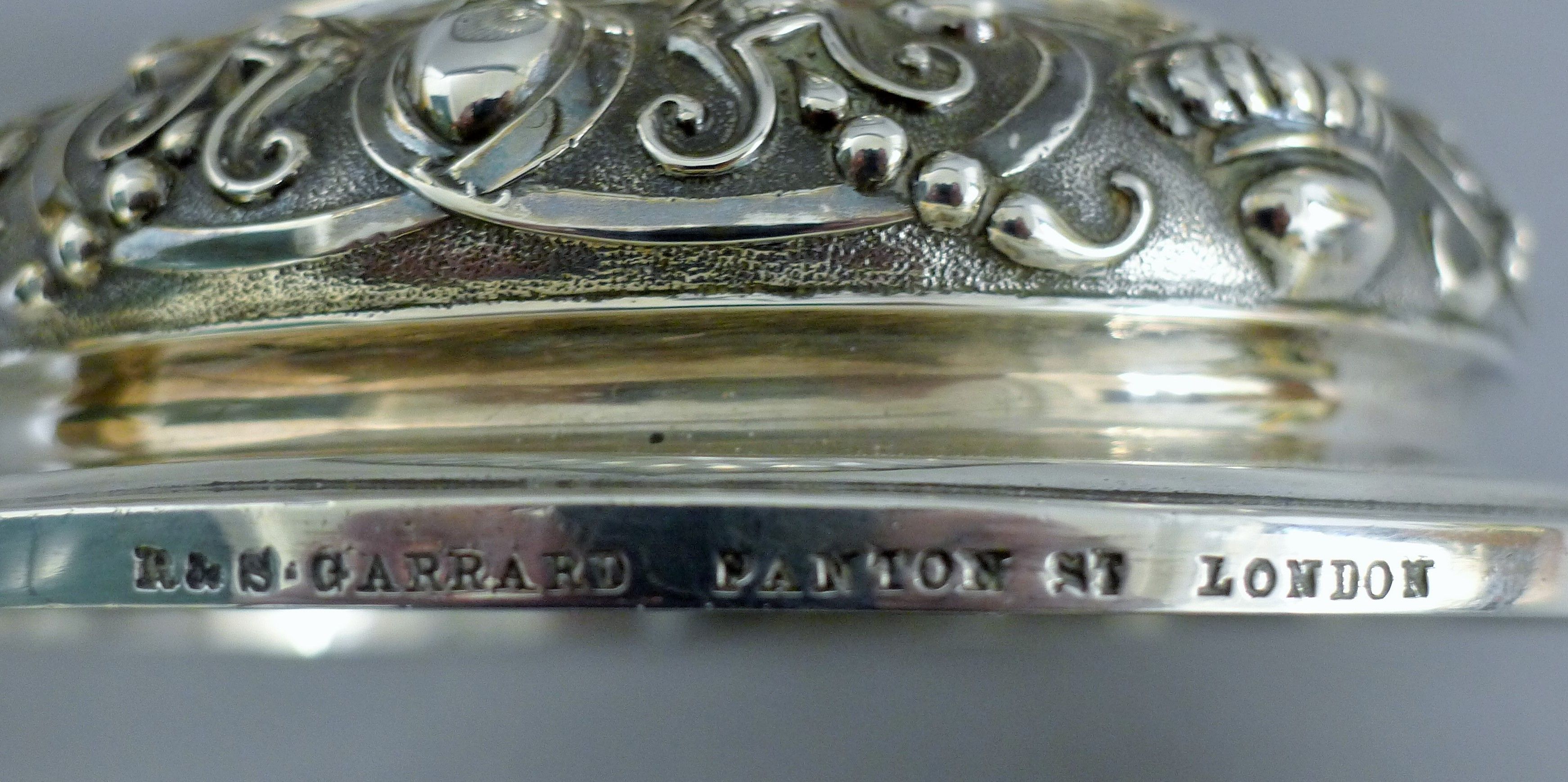 A Victorian silver centrepiece, the stem formed as a putto holding a pierced basket, - Image 10 of 10