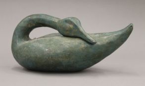 A painted terracotta model of a swan. 35 cm long.