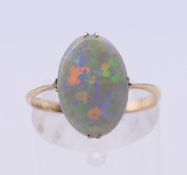 A 9 ct gold and opal ring. Ring size M/N.
