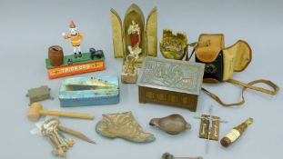 A box of miscellaneous items including tins, a money box, a camera etc.