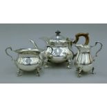 A three-piece silver tea set. The teapot 27 cm long. 34.5 troy ounces total weight.