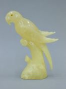 An alabaster model of a parrot. 21 cm high.