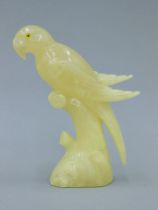 An alabaster model of a parrot. 21 cm high.