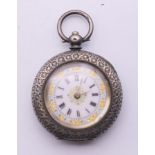 A silver ladies' fob watch. 3.5 cm diameter.