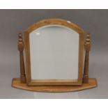 A modern oak dressing mirror. 68 cm wide overall.