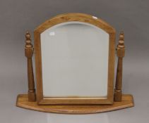 A modern oak dressing mirror. 68 cm wide overall.