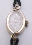 A ladies Hamilton 10 K gold wristwatch. 1.5 cm wide. 9.2 grammes total weight.