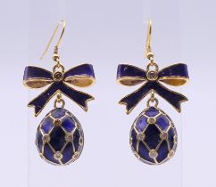 A pair of silver gilt and enamel egg form earrings bearing Russian marks. 3.75 cm high.
