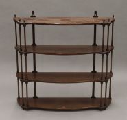 An early 20th century mahogany hanging shelf. 83 cm wide.