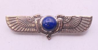 A silver and lapiz Egyptian revival brooch. 5 cm wide.