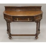 An early 20th century oak barley twist side table. 108 cm wide.