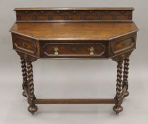 An early 20th century oak barley twist side table. 108 cm wide.