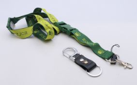 A Rolex key ring and lanyard. The former 9 cm long.