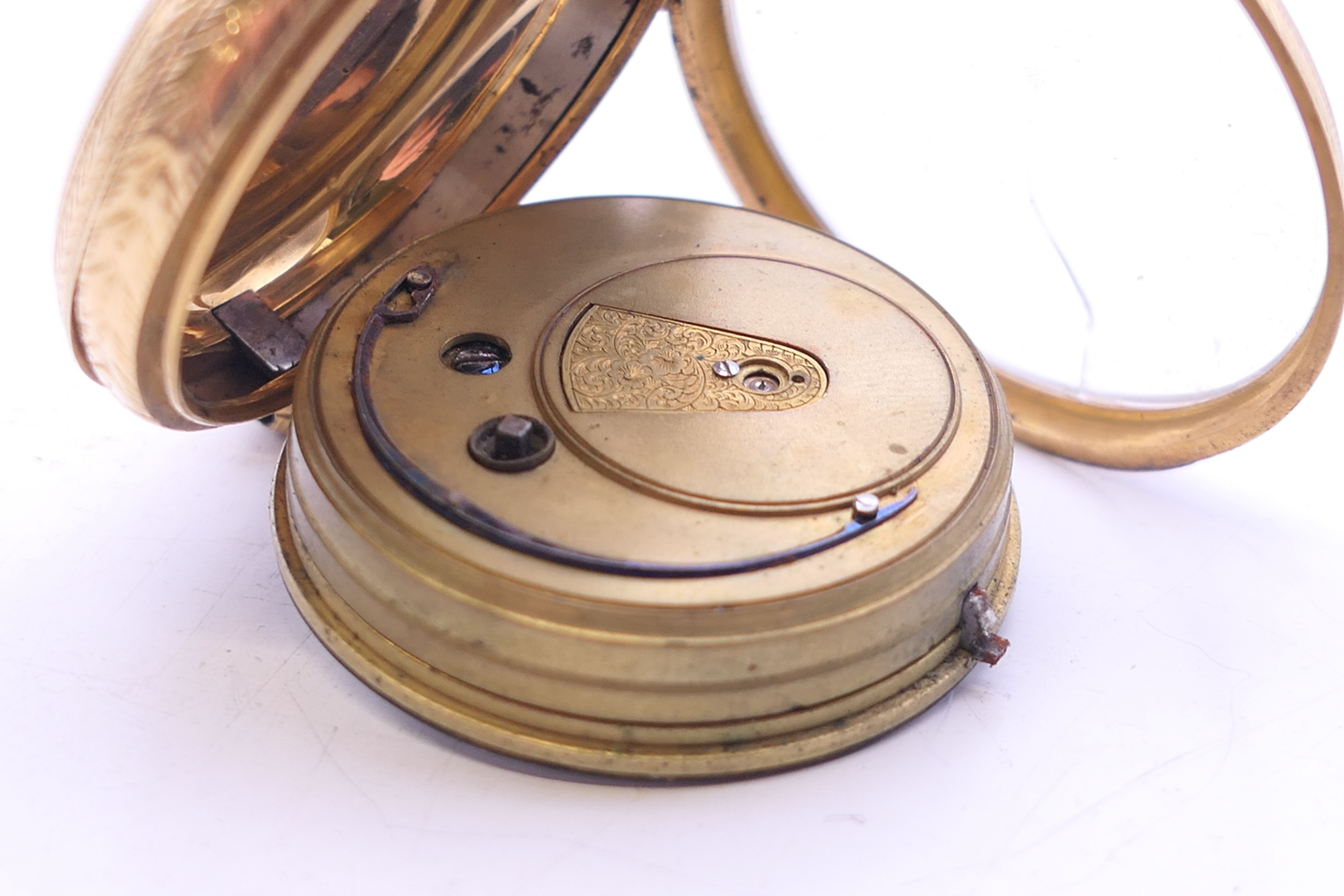 An 18 K gold open-faced pocket watch. 4 cm diameter. 61.8 grammes total weight. - Image 9 of 10