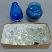 A Medina glass vase, another vase and a quantity of decanter stoppers. The former 19.5 cm high.