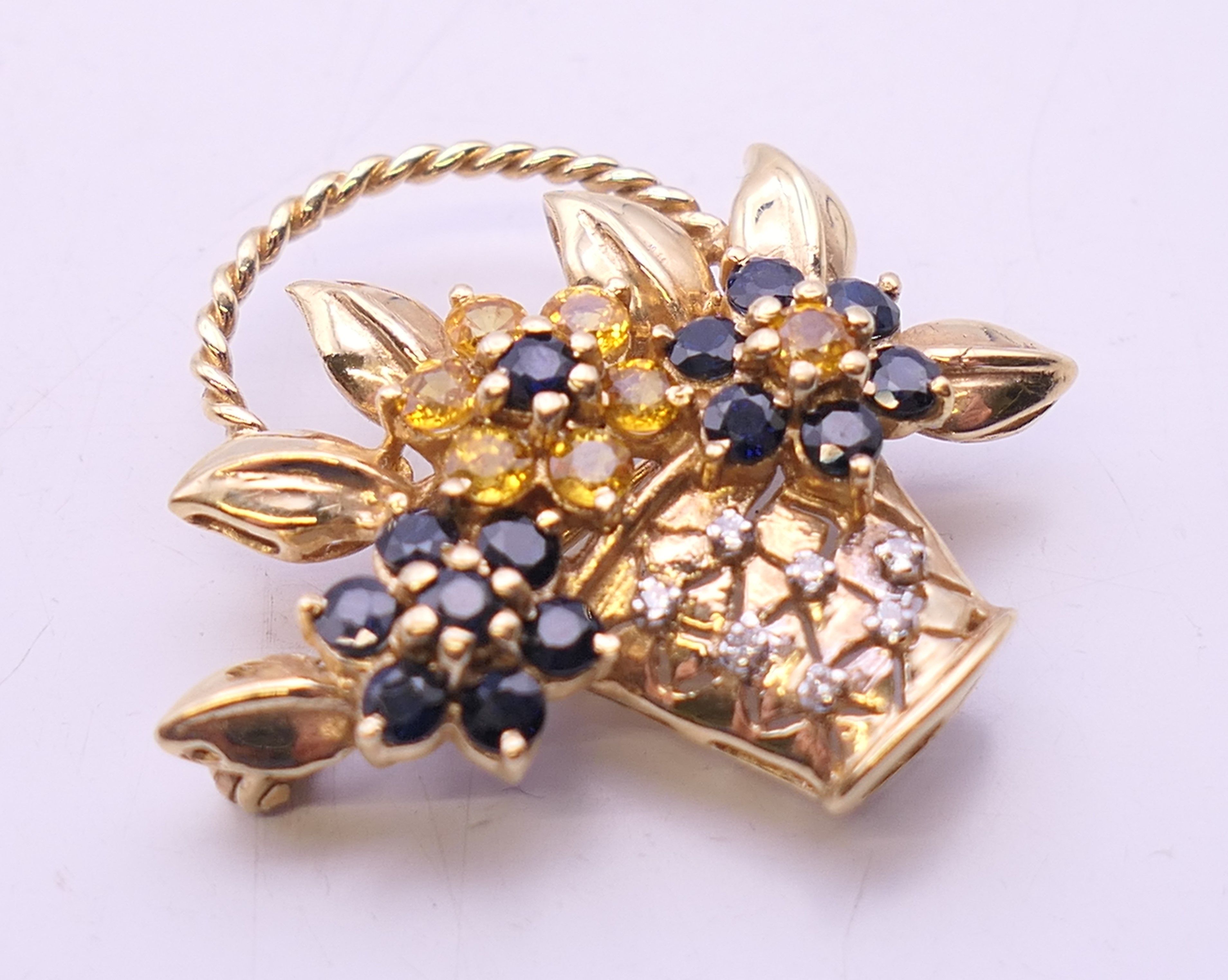 A 14 ct gold diamond, sapphire and citrine floral basket brooch. 3 cm high. 7. - Image 2 of 4