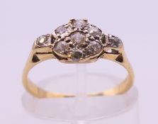 An unmarked gold diamond set ring. Ring size K/L.