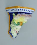 A faience wall bracket. 13.5 cm high.