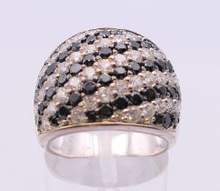 A silver black and white cubic zirconia ring. Ring size N/O.