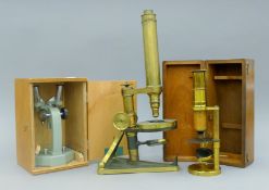 A Beck of London brass microscope, a field/student brass microscope and a binocular microscope.