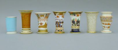 Seven 19th century spill vases including Spode and Imari. The largest 12.5 cm high.
