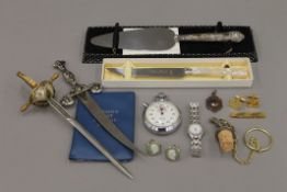 A box of miscellaneous items including paper knives, coins, cufflinks etc.