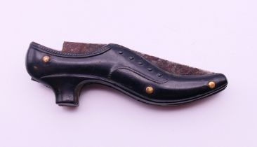 A 19th century penknife in the form of a shoe. 5 cm long.