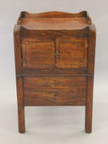 A 19th century mahogany bedside cupboard. 49.5 cm wide.