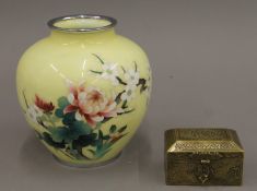 A Persian brass casket and a yellow ground cloisonne vase.