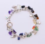 A silver and gemstone bracelet. 18 cm long.