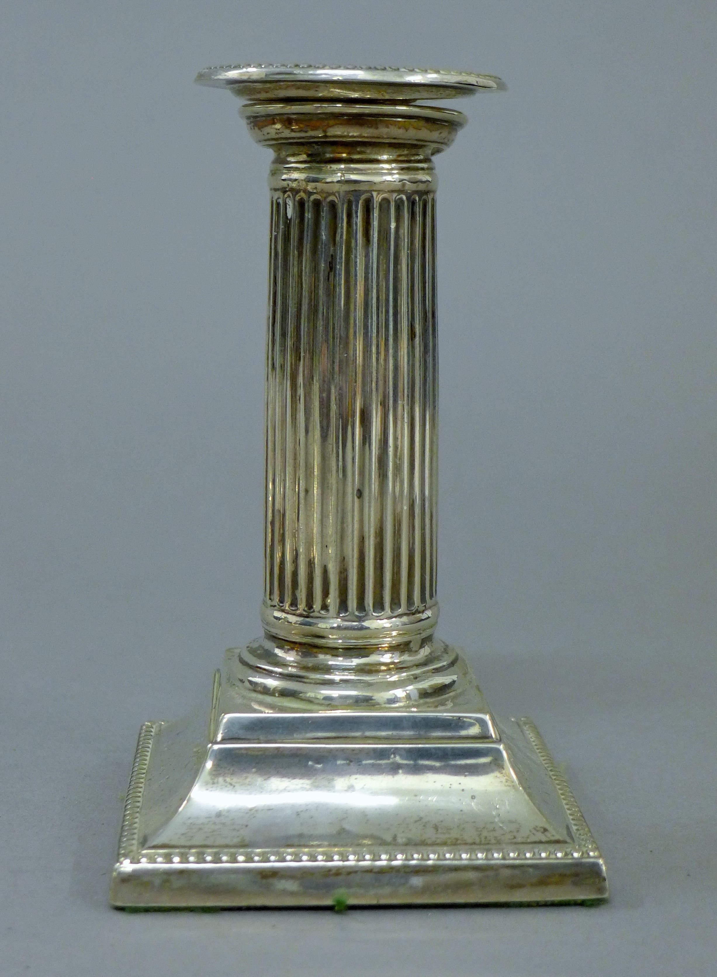A pair of silver candlesticks. 12.5 cm high. - Image 2 of 4