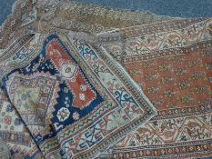 Two red ground rugs and a pale ground rug. 125 cm x 187 cm , 99 cm x 385 cm and 129 cm x 243 cm.
