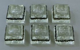 A set of six unmarked silver-mounted glass salts. Each 3.5 cm wide.